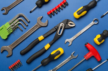 Set of tools on color background, top view