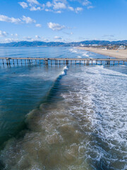 Aerial photographs of the Venice Fishing Pier. Photos taken with a drone, capturing surfers ride...