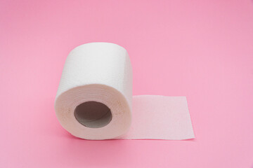 White simple toilet paper on pink background