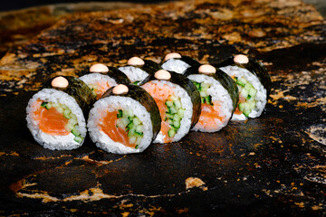 Delicious Sushi Roll on a stone Plate