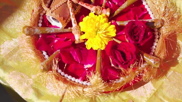 Close up shot of Mehndi cones in decorated plate in Indian home during Mehndi ceremony celebration as a part of Indian wedding. Traditional Indian wedding.
