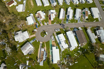 Destroyed by hurricane Ian suburban houses in Florida mobile home residential area. Consequences of...