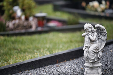 statue of angel  child faith remembrance winged spiritual bereavement life expression grey...