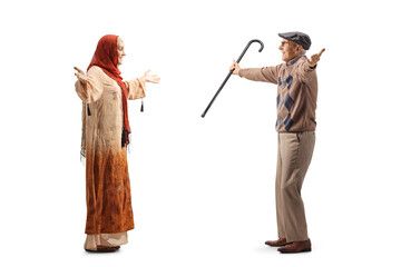 Young muslim woman meeting a cheerful elderly man