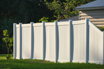 White plastic fence for back yard protection and privacy