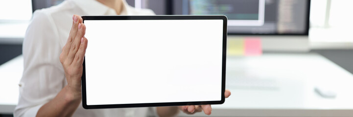 Businessman is holding tablet with space for text
