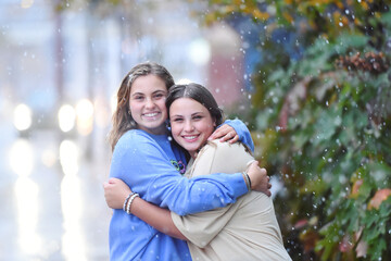 Tween girls in snowfall