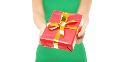 Gift. Woman giving red Christmas gift / present. Closeup of woman holding and showing red Christmas present with gold ribbon on pure white background.