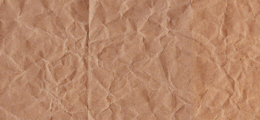 Craft wrapping paper. The texture of a flat crumpled sheet of cellulose products. Old tattered page...