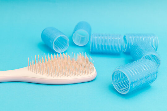 Blue hair curlers on a blue background