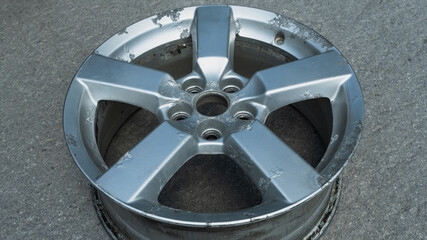 Corrosion on a silver aluminum alloy wheel close-up