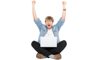 Man cheering with laptop computer and arms raised winning happy. Young Caucasian male model sitting...