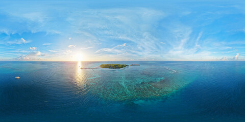Panoramic view of Alimatha island in the Maldives, Vaavu Atoll, at sunset, with luxury over water villas. Aerial seamless 360 degree spherical panorama