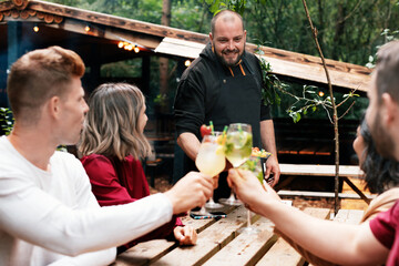 friends in cafe drinking happily a cocktail
