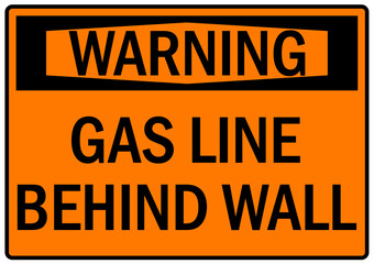 Fototapeta premium Pipeline sign and labels gas line behind wall