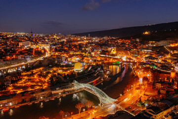 Panoramic night aerial view of Tbilisi, capital of Georgia from drone