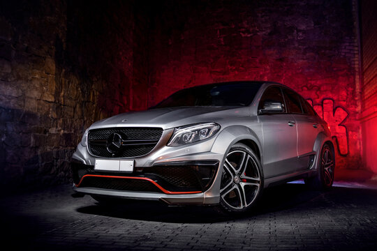 red sports car on black background car in the night Mercedes GLE AMG SUV