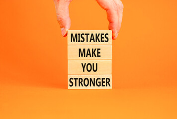 Mistake make stronger symbol. Concept words Mistakes make you stronger on wooden blocks. Beautiful...