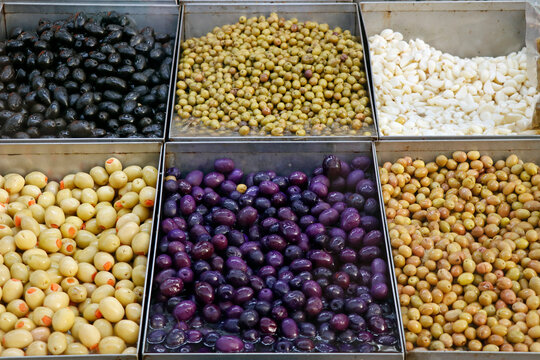 variety selection of marinated and pickled olives in a food stall for selling