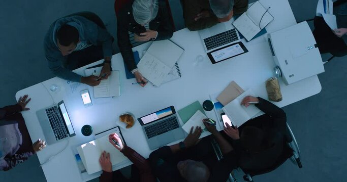 Night business meeting, office teamwork planning and working late for company discussion, collaboration and talking in modern office. Above of executive workforce, management and dark group strategy