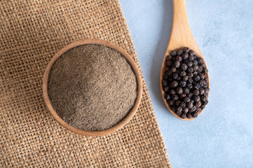Ground black pepper with grains of black pepper,top view