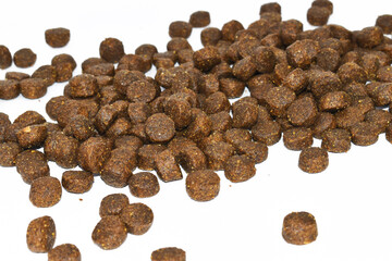 Dry dog food isolated on white background, top view