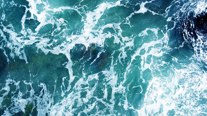 Aerial view of the ocean water surface and waves. Beautiful water background texture for tourism...