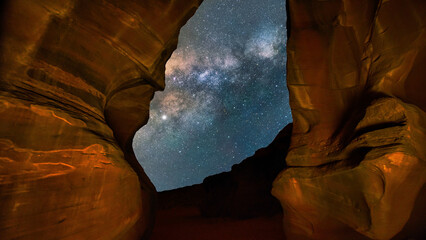 The rock formations of Antelope Canyon under a stunning evening sky with many stars in Page, Arizona, USA.