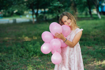 portrait of a girl with pink balloon