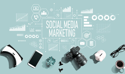 Social media marketing theme with electronic gadgets and office supplies - flat lay