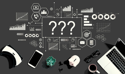 Question marks with electronic gadgets and office supplies - flat lay