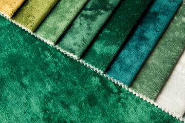 Bright collection of gunny textile samples. Multicolor fabric texture background. Samples of fabrics of different quality and category for furniture upholstery or curtains.