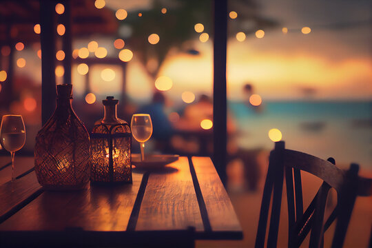 Outdoor restaurant at the beach. Table setting at tropical beach restaurant. beautiful sunset sky, sea view. Luxury hotel or resort restaurant.