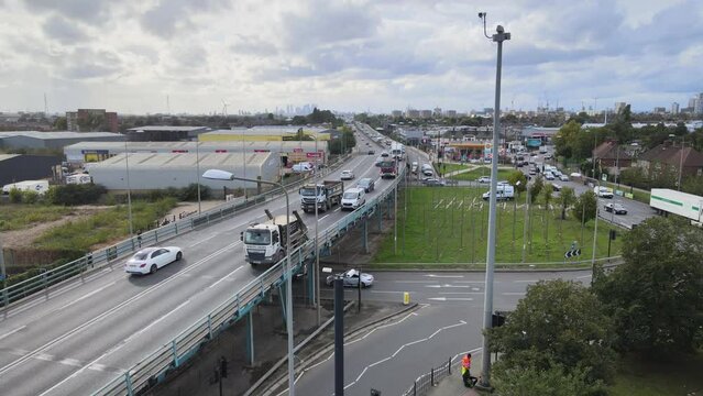 Aerial shot of transport infrastructure in city. Busy elevated multilane road and intersection under. London, UK