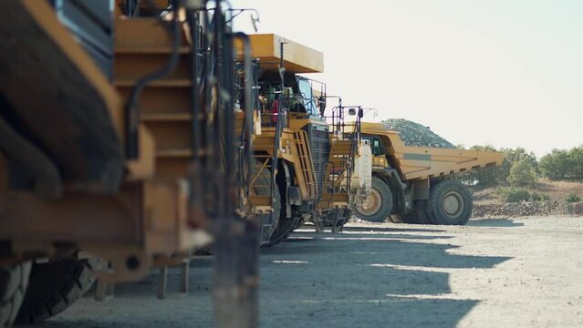 Open pit mine industry, parked big yellow mining truck for coal anthracite