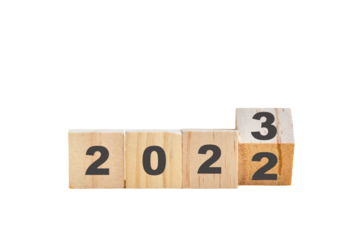 Wood block with new year 2022 change to 2023. Isolated, transparent background.