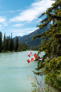 Canadian Flag On The Edge Of Lake