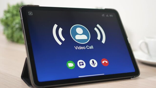 Video Chat App Receiving Incoming Call On a Tablet Closeup
