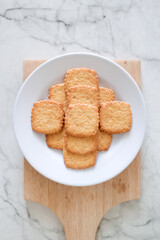 Potato chips biscuit on a white plate. Delicious crispy potato chips biscuits in plate. Space for text. Top view. Sweet potato buttermilk biscuits homemade for breakfast
