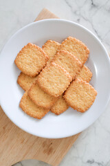 Potato chips biscuit on a white plate. Delicious crispy potato chips biscuits in plate. Space for text. Top view. Sweet potato buttermilk biscuits homemade for breakfast
