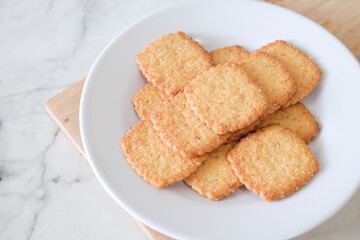 Potato chips biscuit on a white plate. Delicious crispy potato chips biscuits in plate. Space for text. Top view. Sweet potato buttermilk biscuits homemade for breakfast