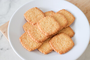 Potato chips biscuit on a white plate. Delicious crispy potato chips biscuits in plate. Space for text. Top view. Sweet potato buttermilk biscuits homemade for breakfast