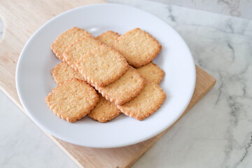 Potato chips biscuit on a white plate. Delicious crispy potato chips biscuits in plate. Space for text. Top view. Sweet potato buttermilk biscuits homemade for breakfast