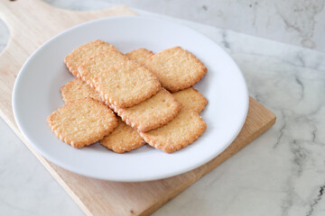 Potato chips biscuit on a white plate. Delicious crispy potato chips biscuits in plate. Space for text. Top view. Sweet potato buttermilk biscuits homemade for breakfast