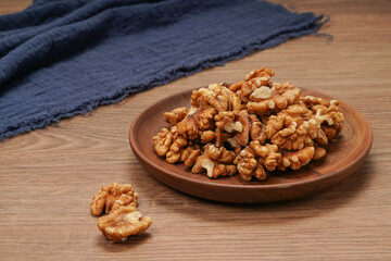 plate of peeled walnuts