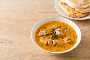 Chicken curry soup with roti