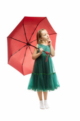 Cute little girl with umbrella on white background. Puzzled little girl thinks.