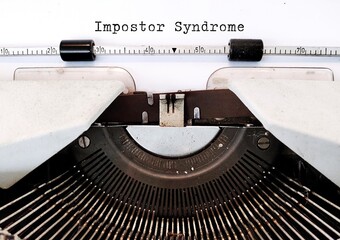 Vintage typewriter with documemt typed Imposter Syndrome - means exaggerated sense of doubt about achievements, fear that others will expose them as frauds