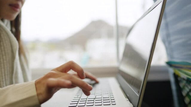 4K Asian woman freelance work on laptop computer during travel on railway transportation. Businesswoman working online corporate business outside office. Work from anywhere and digital nomad concept.
