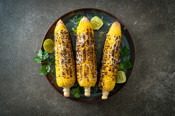 barbecue and grilled corn with cheese and lime